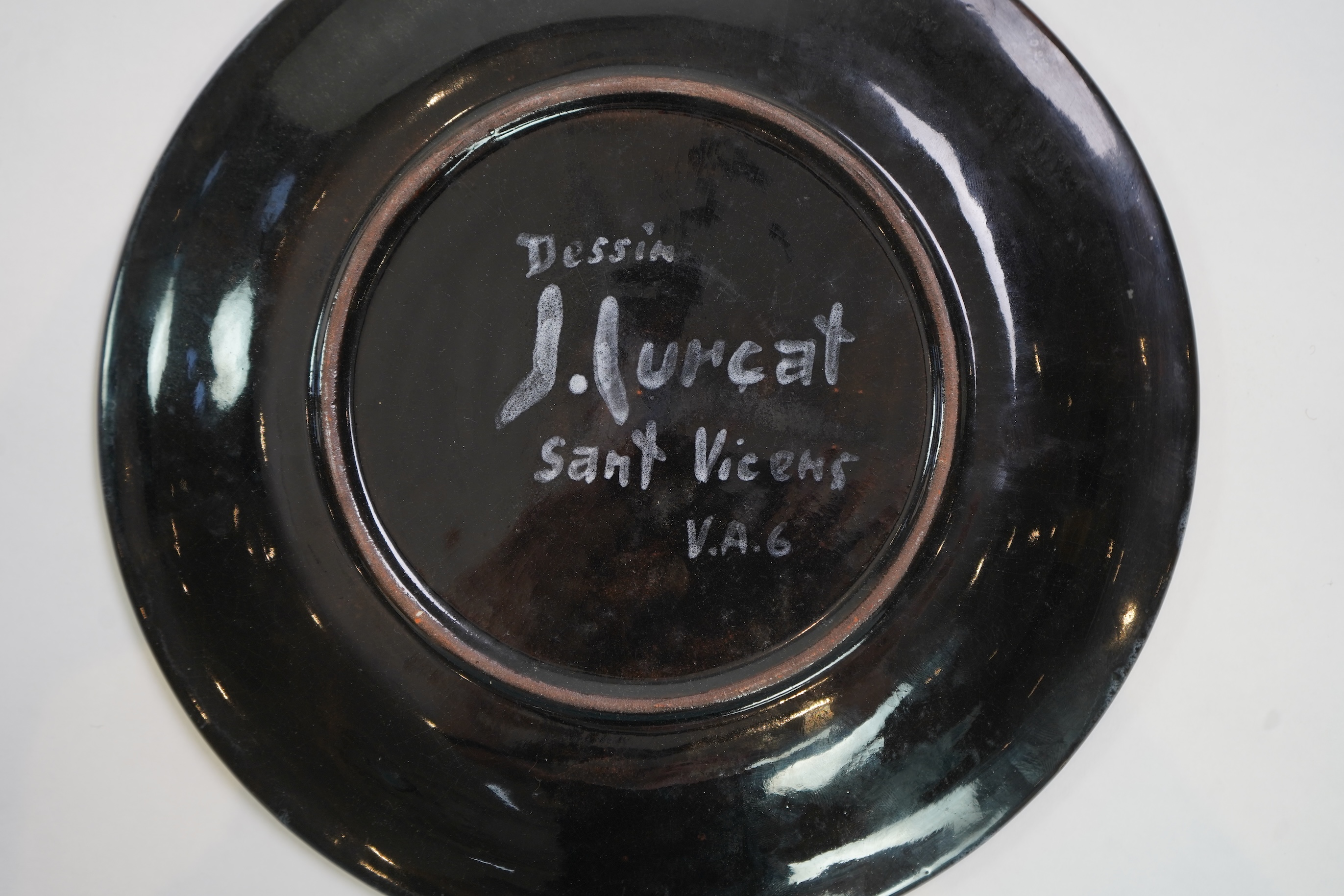 Jean Lurçat (1892-1966): A green glazed earthenware plate, decorated with a stylised central figure